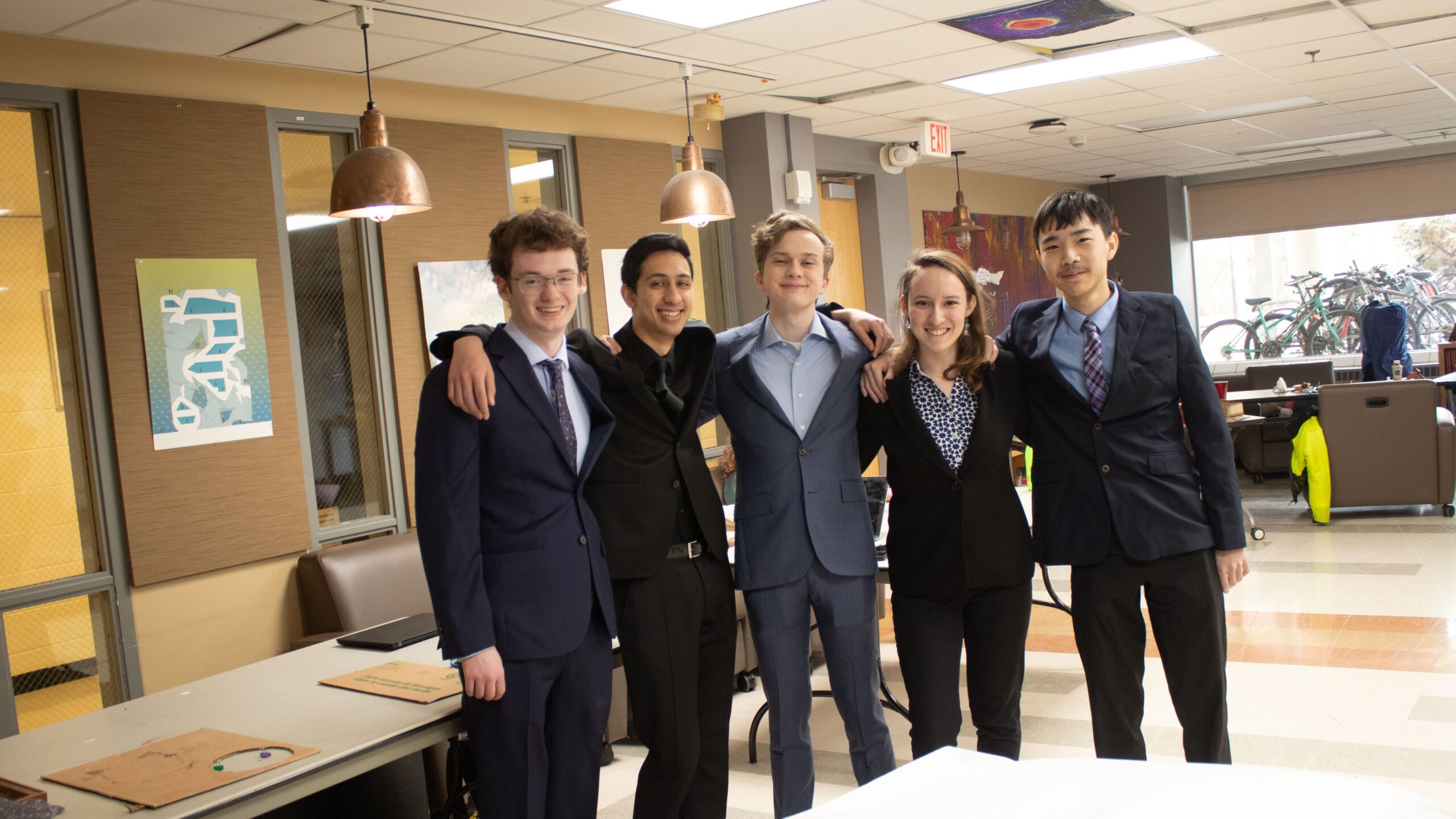 five students in suits